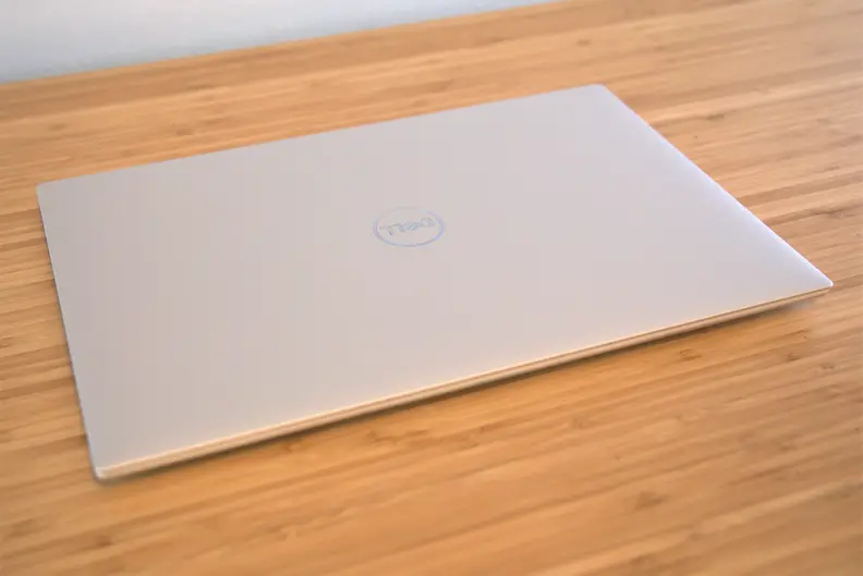 A Dell XPS 15 with OLED display on a desk.