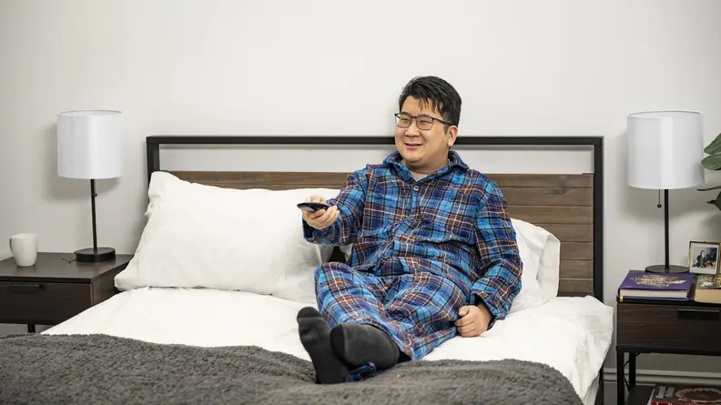 Man wearing set of flannel L.L. Bean pajamas