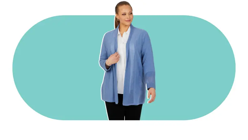 A model wearing a blue cardigan over a white dress shirt.