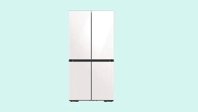 A white Samsung refrigerator against a light blue background.