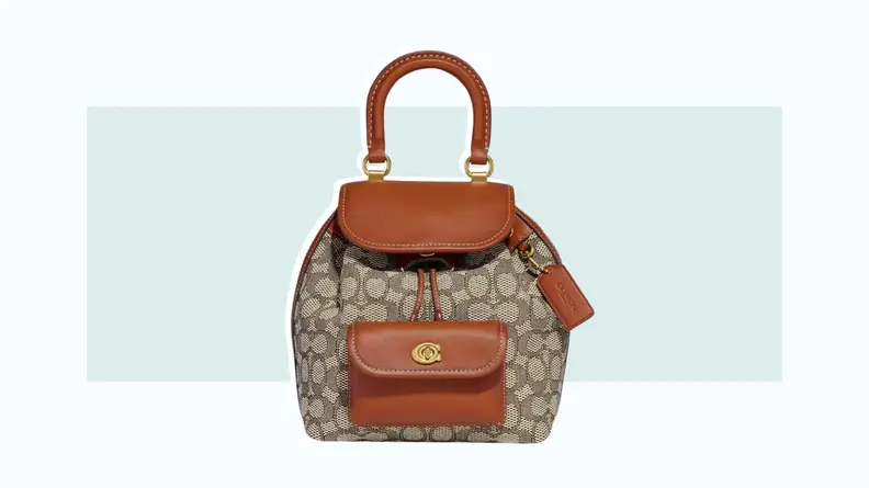 A backpack made from brown leather and the Coach monogram logo print.