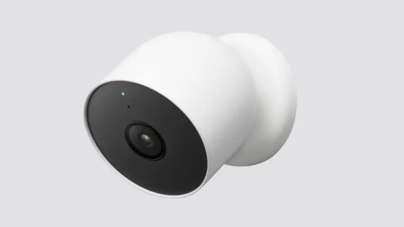 A security camera placed on a gray background