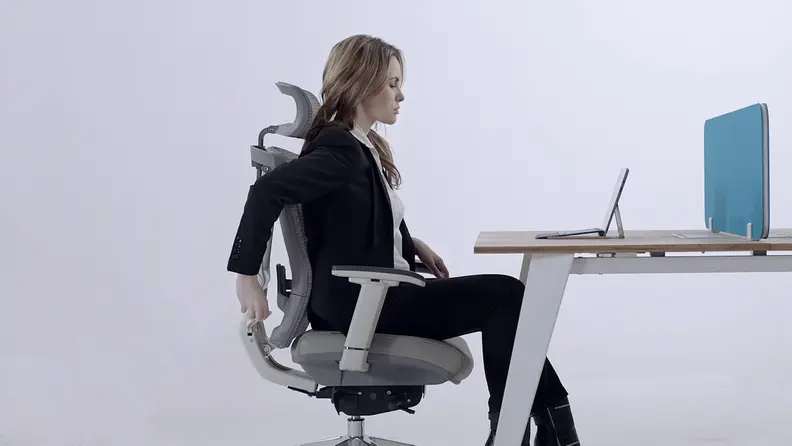 Woman sitting in desk chair