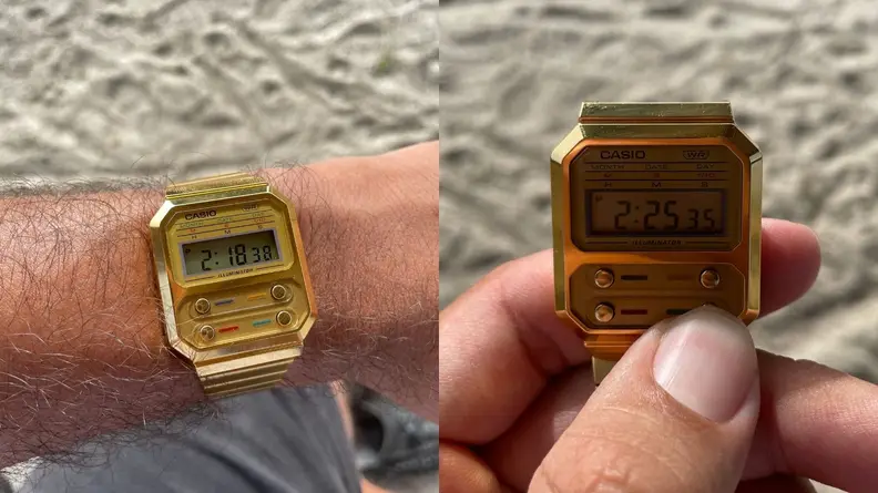 Casio-A100WEG-9AVT on the wrist, hand holding Casio-A100WEG-9AVT.