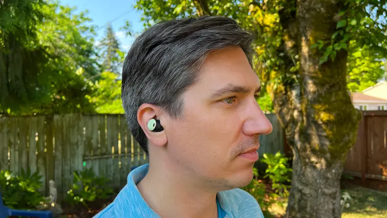 A far shot of a Pixel Bud Pro in a man's ear.