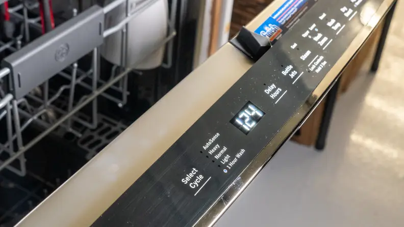 A close-up of the GE Profile PDP715SBNTS dishwasher's top-facing control panel.