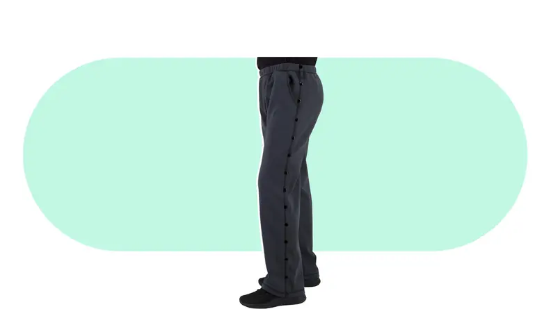 Bottom shot of a person modeling a black pair of Post Surgery Tearaway Pants.