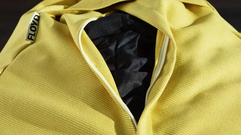 Close up of the yellow, durable fabric on the Floyd Squishy Chair.