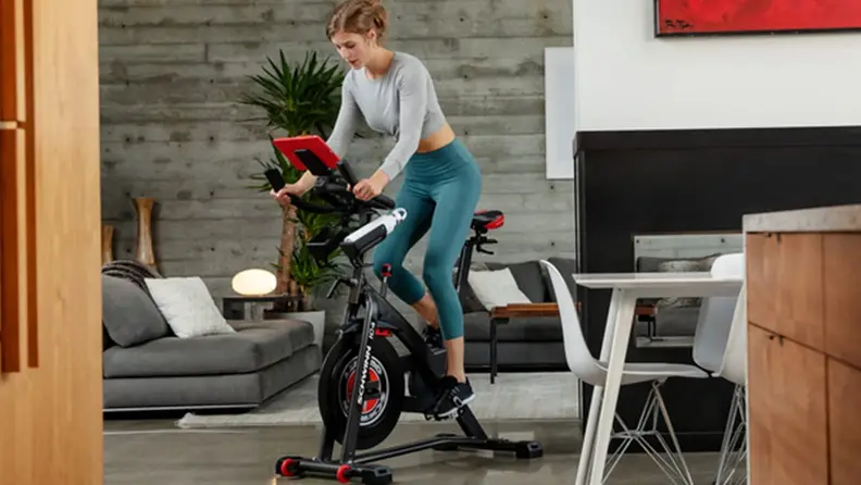 A person works out on an exercise bike.