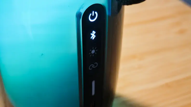 A close up of the JBL Pulse 5's touch controls on the side of the speaker.