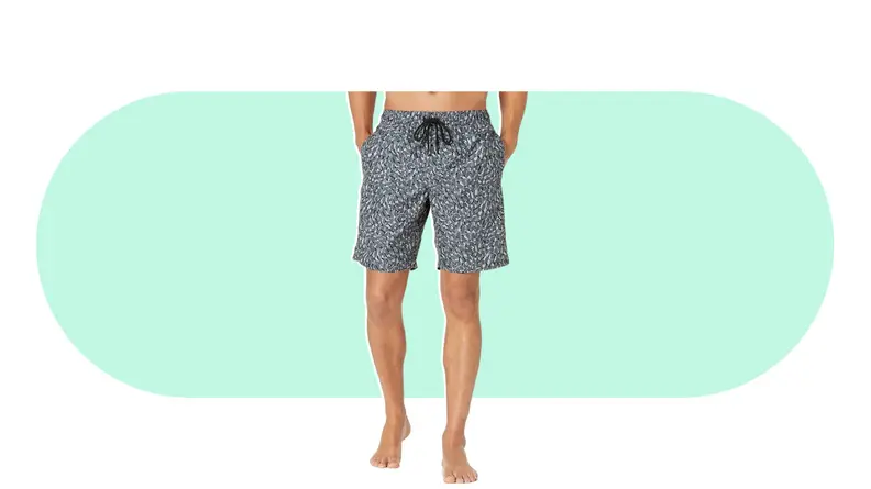 Close-up of a person modeling a pair of swimming trunks.