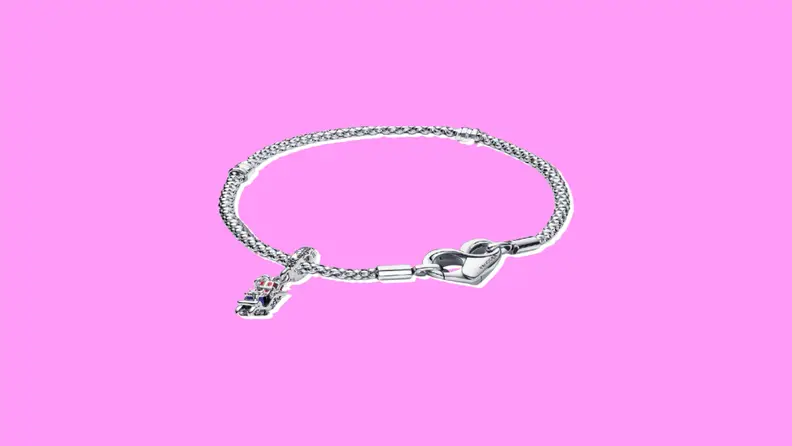 A Pandora Charm Bracelet on a purple background.