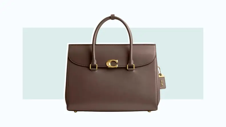 A brown handbag with a flap closure and top handles.