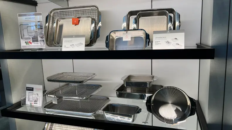 Two shelves of Hestan Cookware on display at the IHS Chicago Awards 2024.