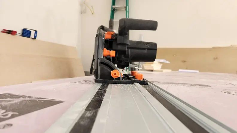 Lowered view of the Wen Track Saw on top of workbench.