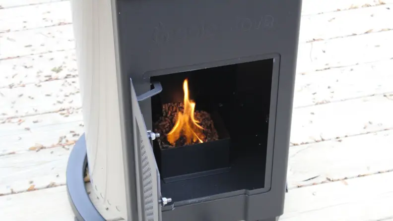 The interior of the Solo Stove Patio Heater with the wood pellets being lit.