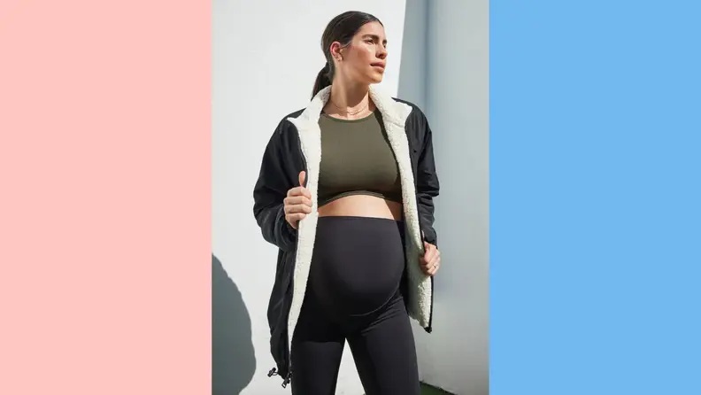 A woman wearing a sporty maternity outfit by Ingrid+Isabel.
