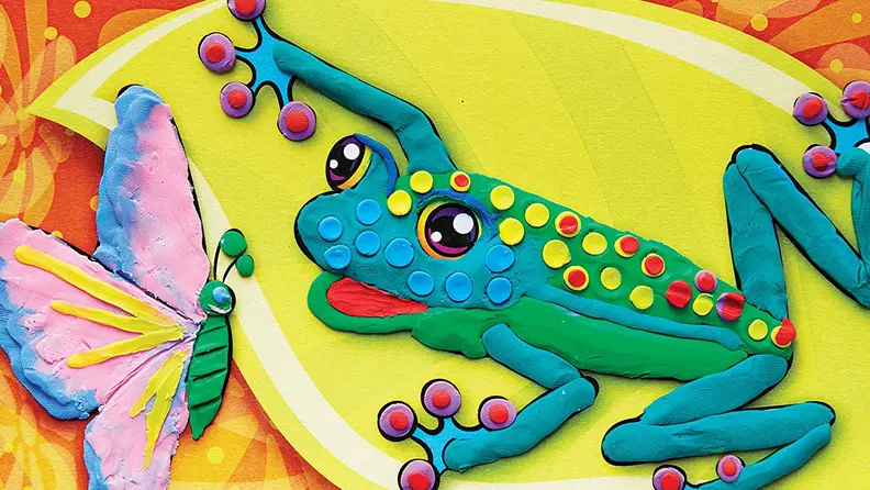 A frog and butterfly made out of clay.
