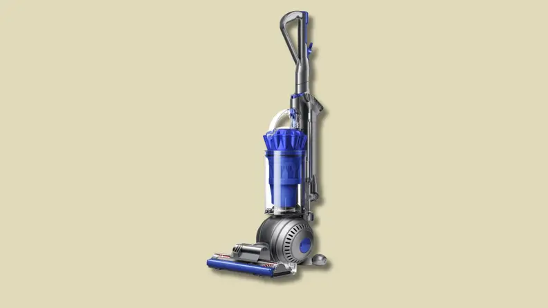 An upright vacuum cleaner on a beige background