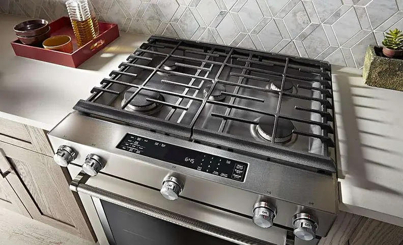 KitchenAid dual fuel range set in a kitchen, shot from above
