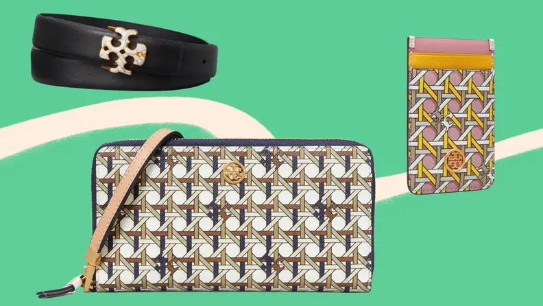 A black belt, a printed wallet and printed clip-on phone accessory against a green background.