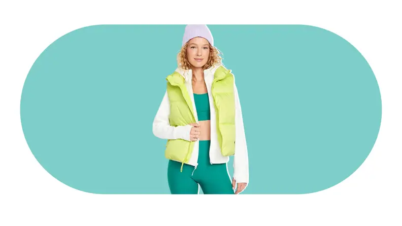 A model wearing a bright green puffer vest.