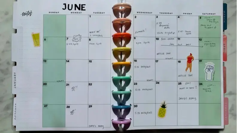 A Happy Planner on the month of June with writing