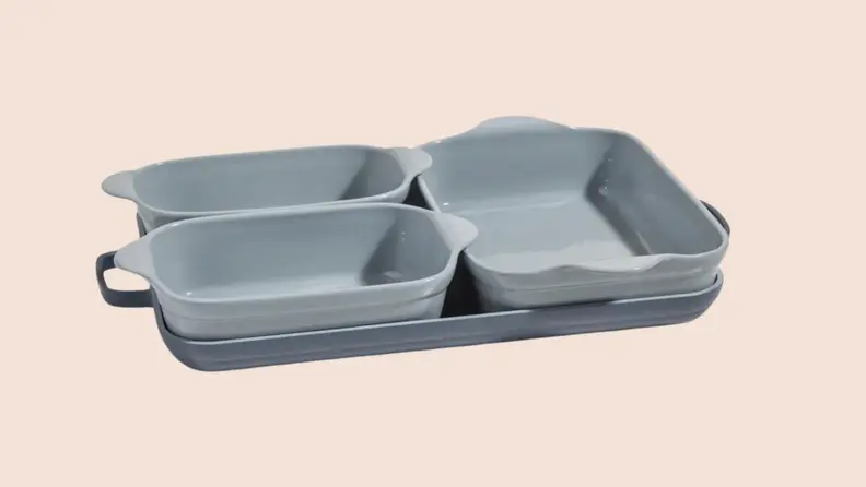 Three pieces of gray Our Place bakeware nested neatly on top of the griddle pan.