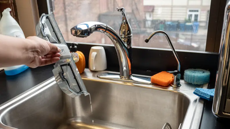 The dirty water tank can be emptied down the drain of your choice.