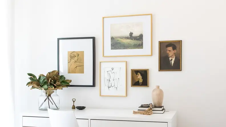 Gallery wall of Pulp prints above a desk