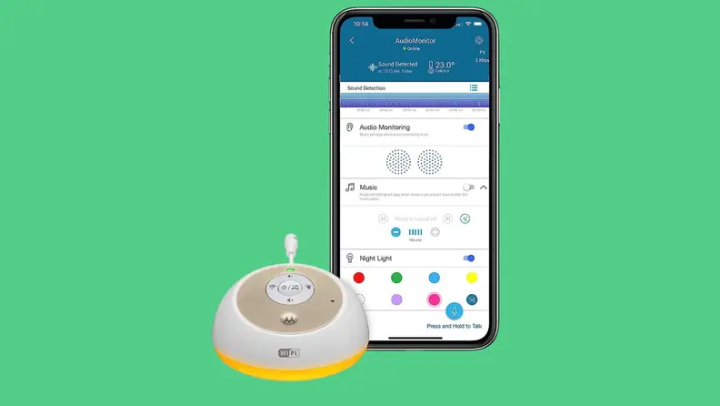 The Motorola MBP163 Connect audio baby monitor and smartphone with app against a green background.