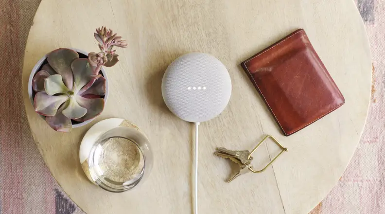 A Google Nest sits on a table.