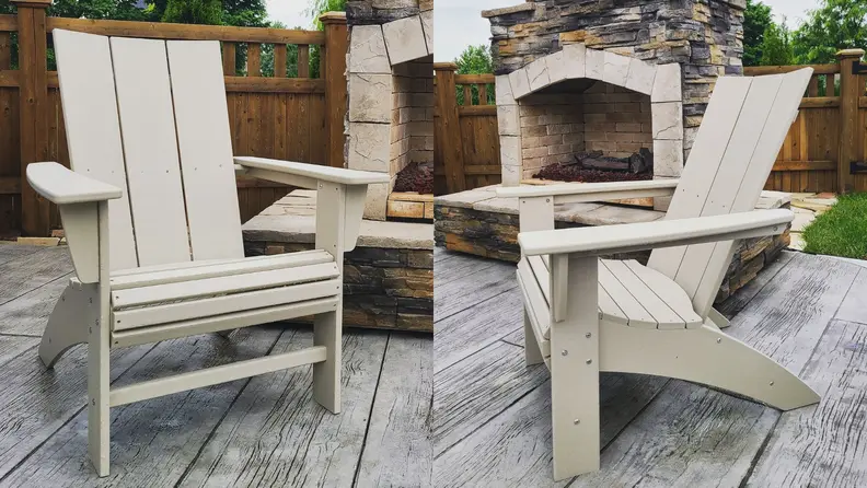 A side by side of the Polywood Modern Curveback Adirondack Chair sitting in front of an outdoor fire place