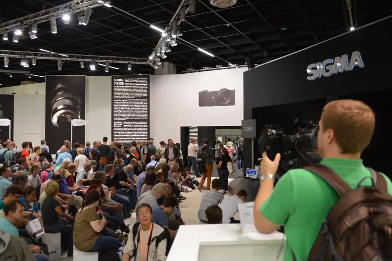 The Sigma booth is a popular destination at Photokina 2014, where shooters can try out Sigma lenses on their DSLRs.