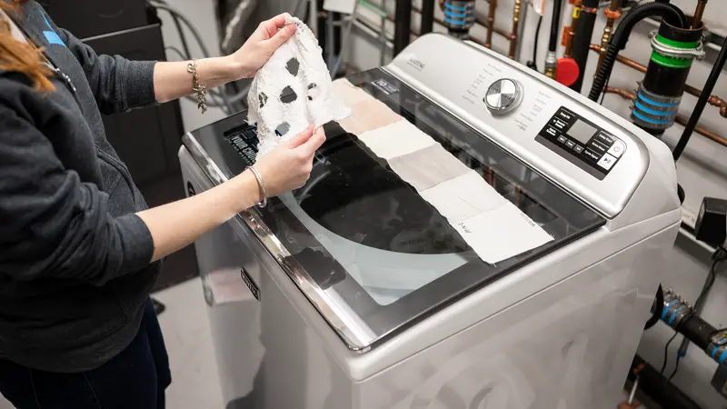 Looking at laundry testing fabric