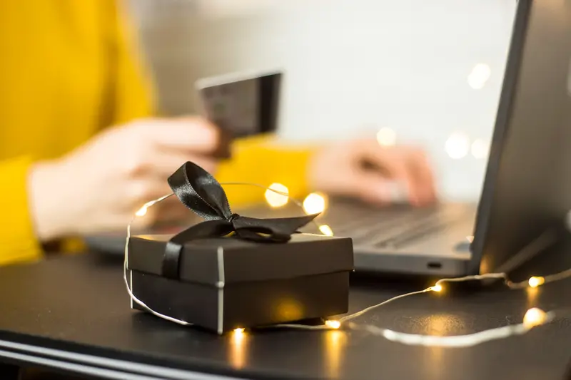 Small present wrapped in black wrapping paper