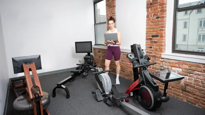 A woman testing rowing machines