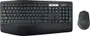A picture of a wireless keyboard and mouse on a desk mat