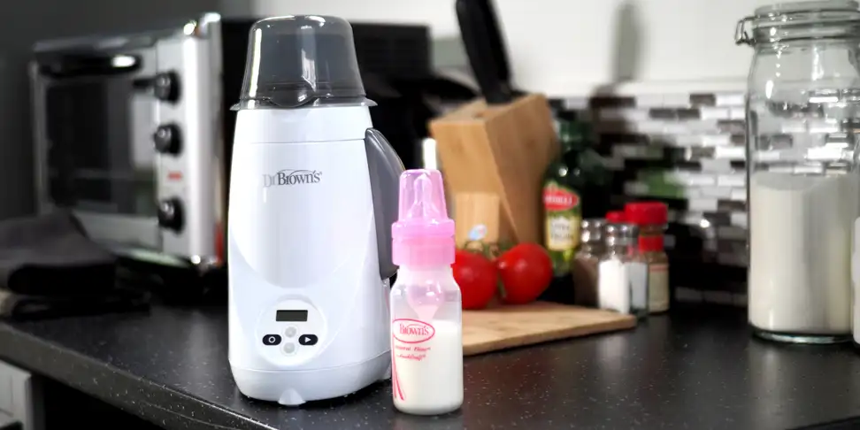 A baby bottle warmer and an accompanying baby bottle
