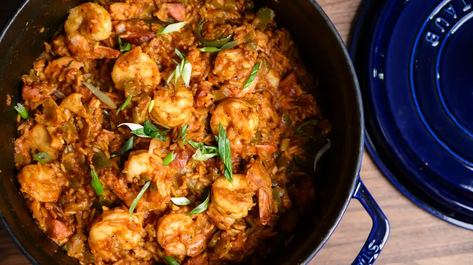 A pot full of homemade jambalaya with the lid removed, shot from above.