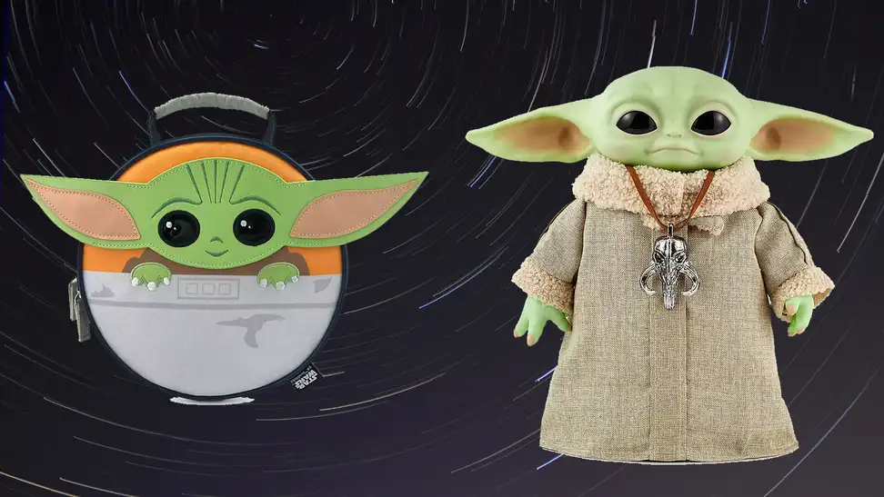 A Baby Yoda lunch box next to an animatronic Yoda