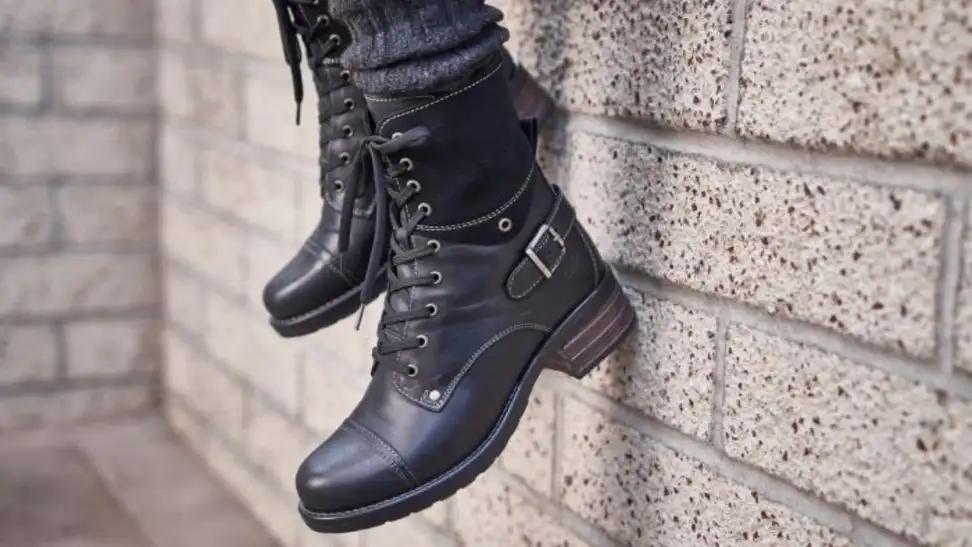 Crave boots from Taos dangling from a wall