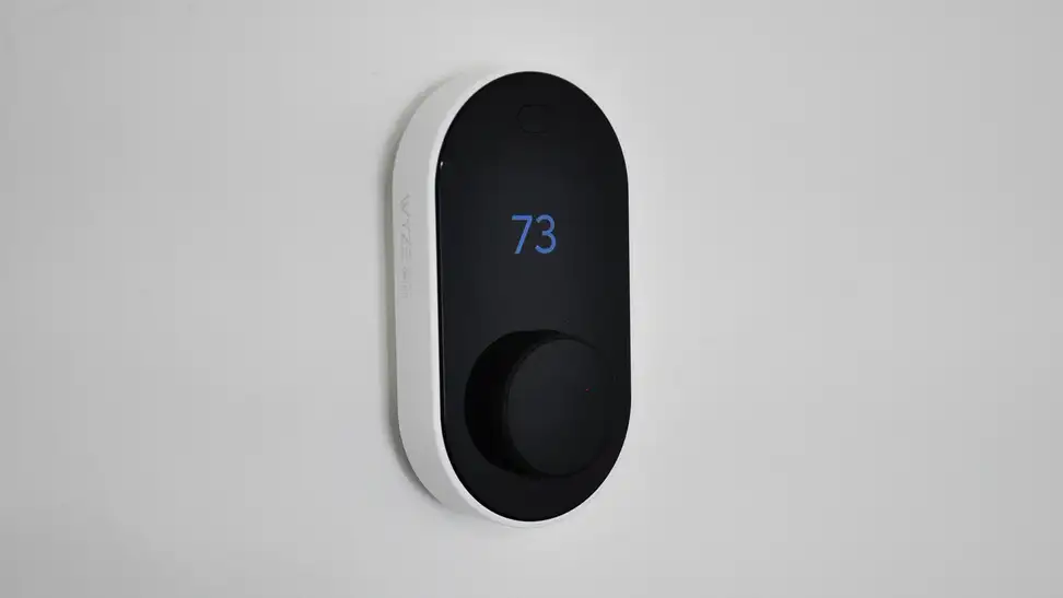 Wyze Thermostat against white wall