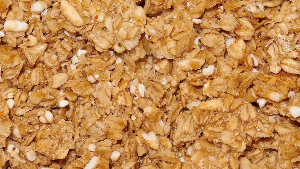 A closeup photo of Safe and Fair Full Stack granola, which is pancake and syrup flavored.
