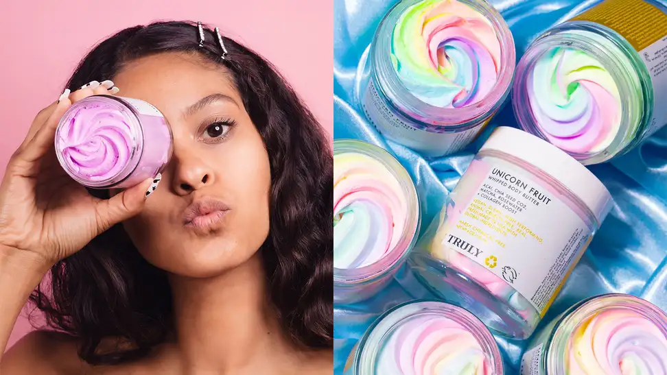 On the left: A woman staring at the camera and holding the Truly Beauty Acai Your Boobies Lifting Boob Polish in front of her eye. On the right: Several jars of the Unicorn Fruit Whipped Body Butter lay on a satin blue sheet with one laying with the label out toward the camera.