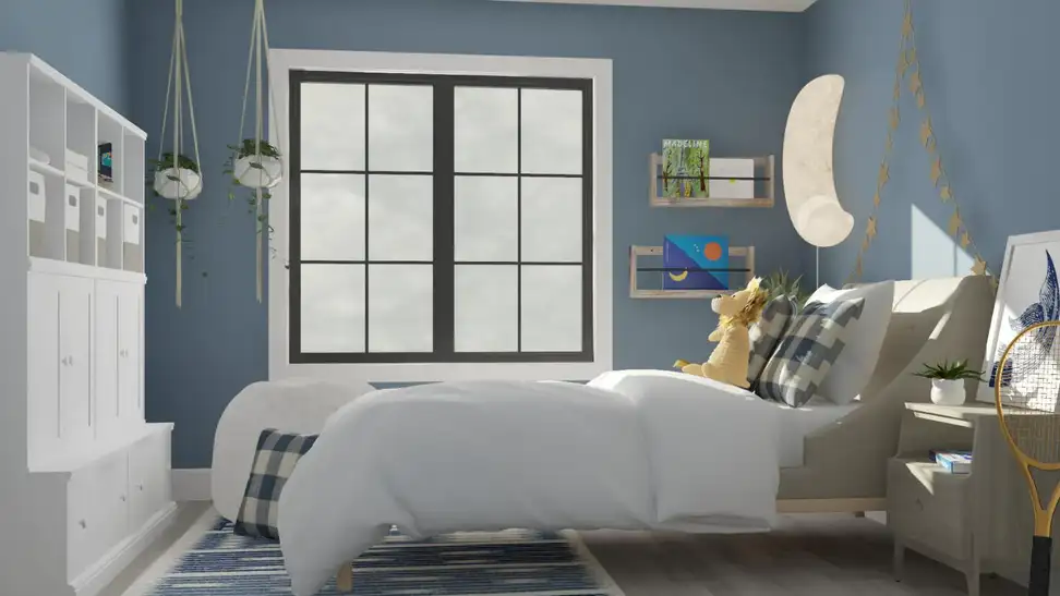 A big kid room with a large bed, blue walls, and big bright window