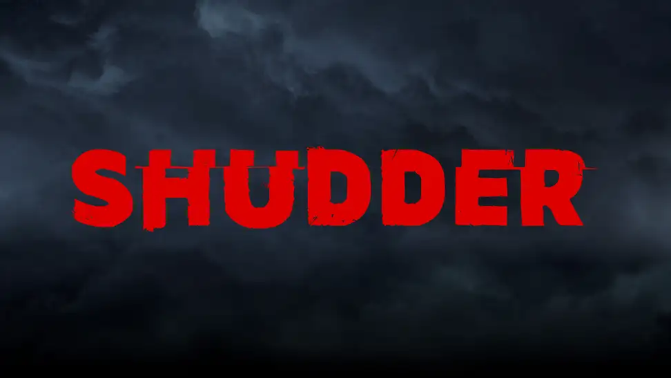 The red Shudder logo is centered against a dark, smoky backdrop.
