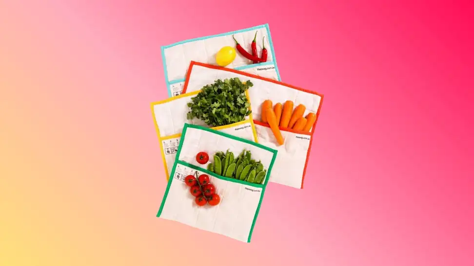 A set of The Swag reusable produce bags against a colorful gradient background.
