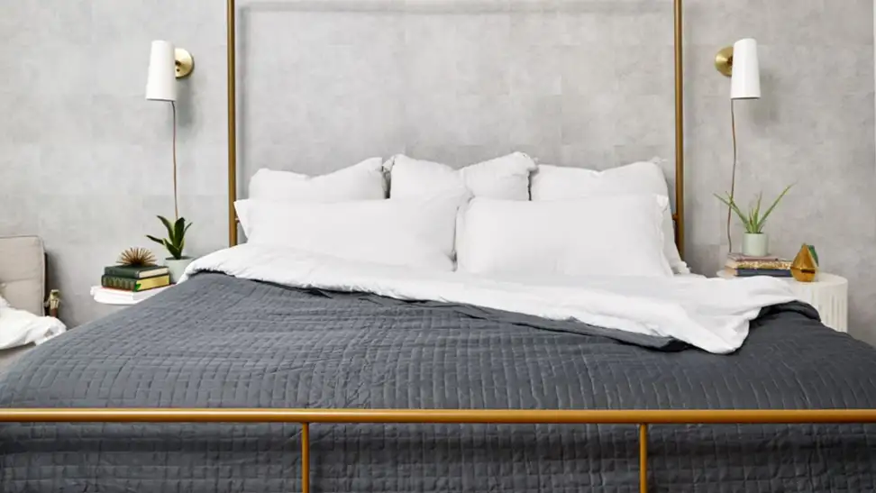 The Cooling Gravity Weighted Blanket on a bed