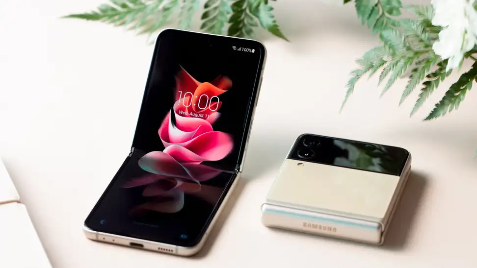 The Samsung Flip sitting on a table closed and half open.
